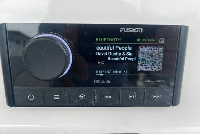 Slide: The Image of Fusion stereo system on 2023 Sea Fox 248 Commander displaying song by David Guetta and Sia. - 14