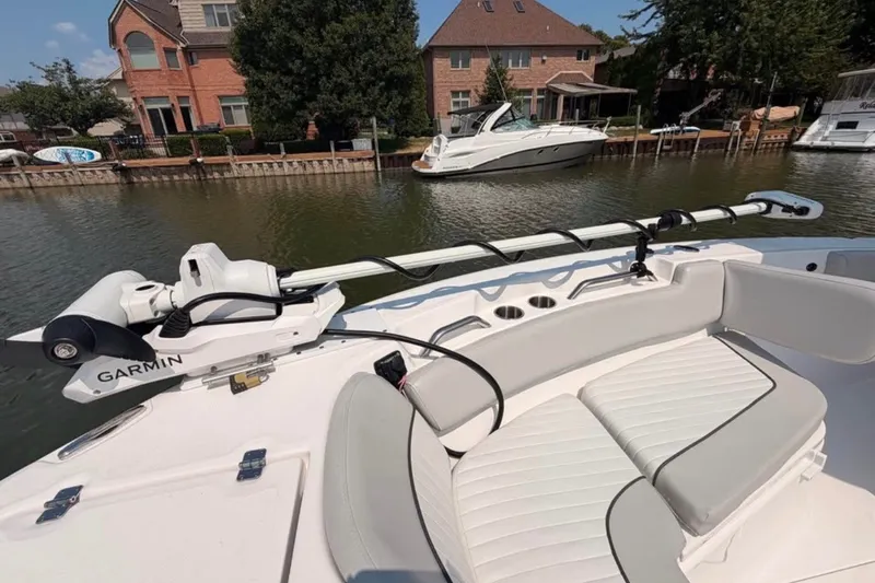 Slide: The Image of 2023 Sea Fox 248 Commander boat with Garmin equipment, docked near waterfront homes. - 22