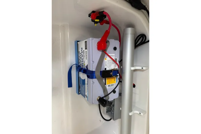 Slide: The Image of Battery setup in a 2023 Sea Fox 248 Commander boat, featuring secure wiring and connections. - 28