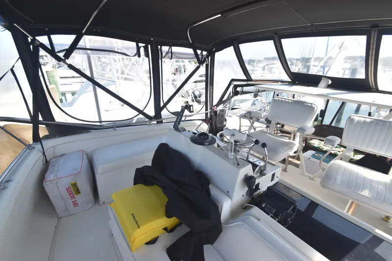 Slide: The Image of The cockpit of a 1981 Viking 43 Aft Cabin with helm and seating. - 41