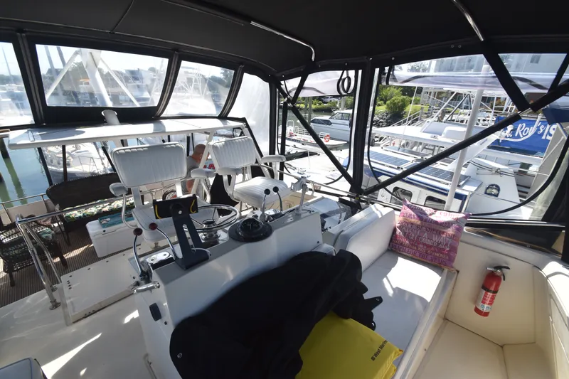 Slide: The Image of The image shows the cockpit of a 1981 Viking 43 Aft Cabin with helm and seating area. - 40