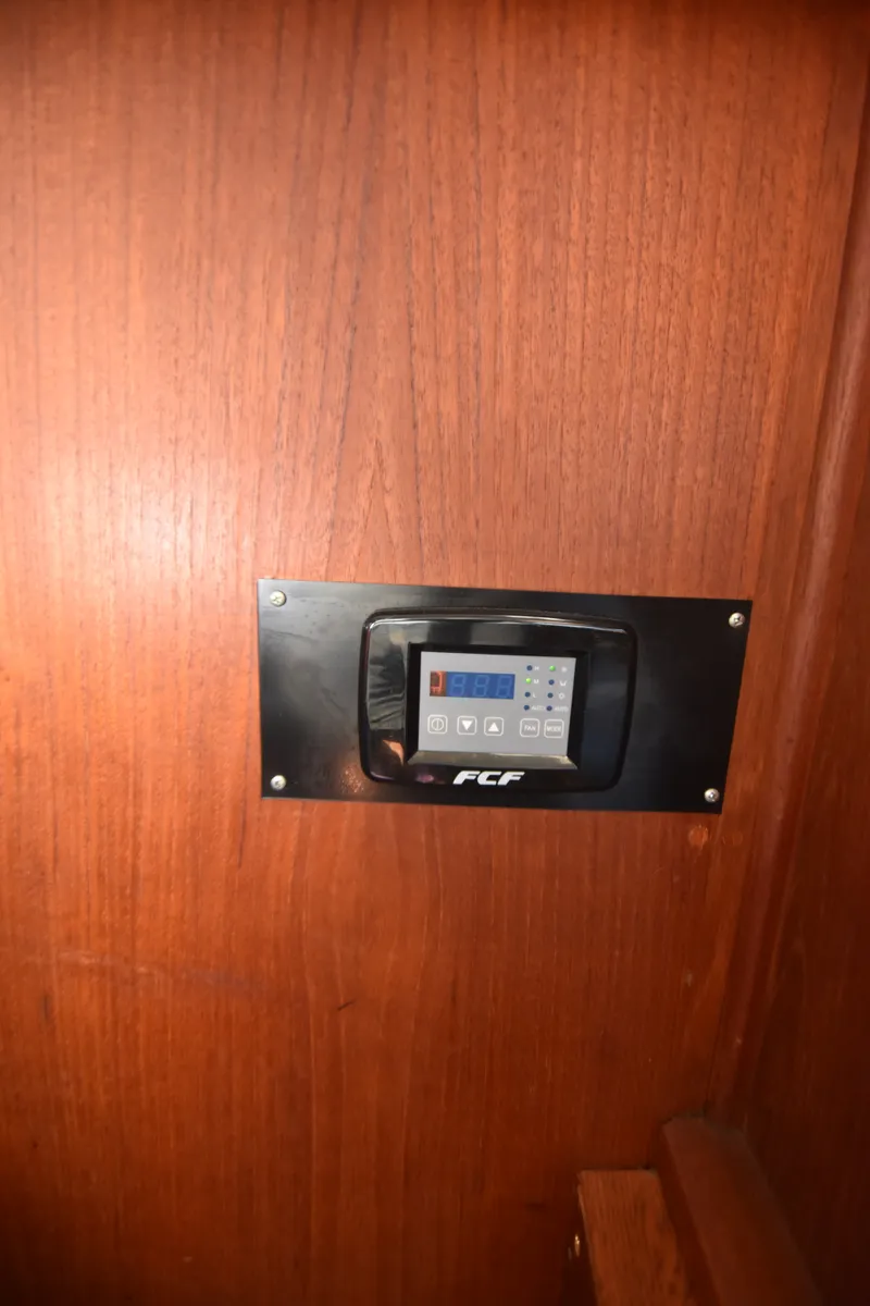 Slide: The Image of A control panel is embedded in a wooden wall. - 19