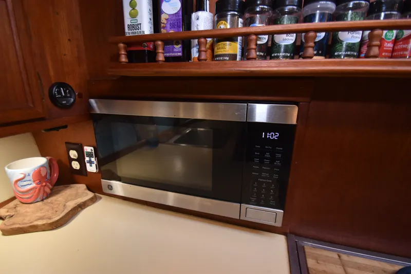Slide: The Image of Kitchen with microwave and spice rack in a 1981 Viking 43 Aft Cabin. - 13