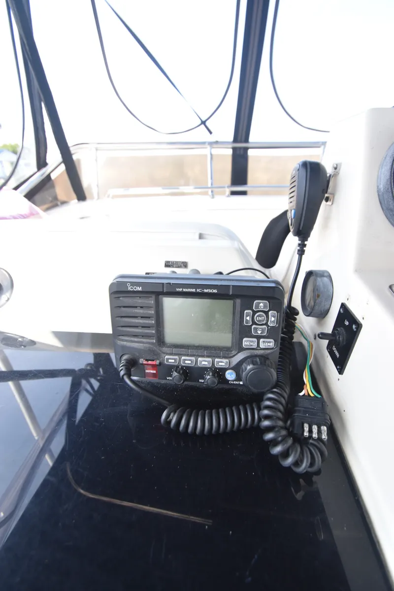 Slide: The Image of Radio on a yacht's helm console, surrounded by cables and a microphone. - 39