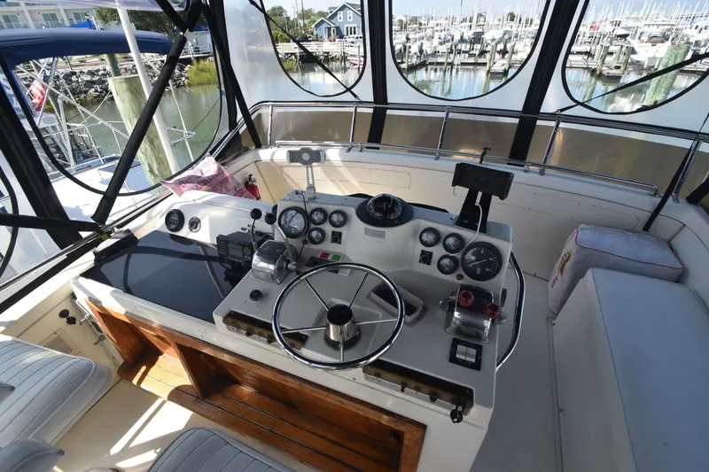Slide: The Image of The image shows the helm of a 1981 Viking 43 Aft Cabin with instruments and steering wheel. - 38