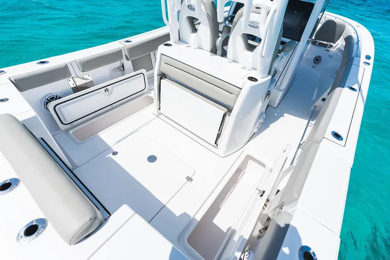 Slide: The Image of Manufacturer Provided Image: 2025 Sportsman Open 302 Center Console boat interior on clear blue water. - 11