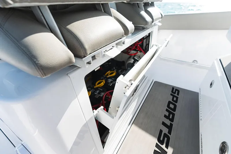 Slide: The Image of Manufacturer Provided Image: 2025 Sportsman Open 302 Center Console boat interior with storage compartment open. - 9