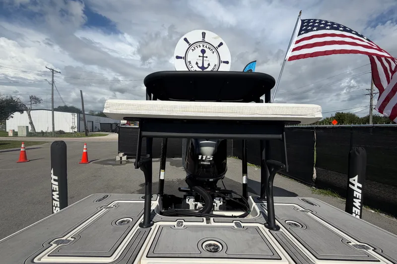 Slide: The Image of 2022 Hewes Redfisher 16 boat with Yamaha 115 engine, American flag, and nautical decor. - 47