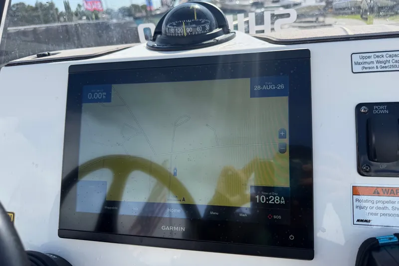 Slide: The Image of Garmin navigation display on 2022 Hewes Redfisher 16 boat dashboard. - 19