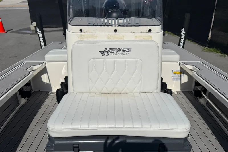 Slide: The Image of 2022 Hewes Redfisher 16 boat interior with white cushioned seat and console. - 39