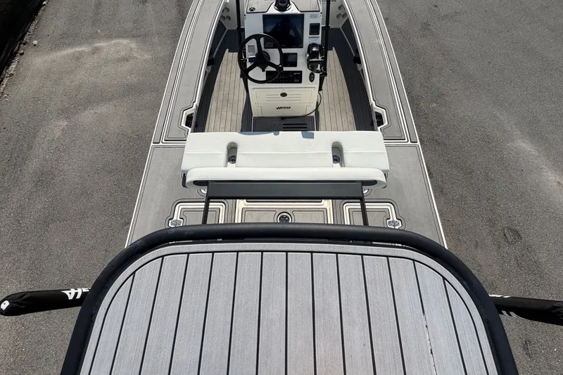Slide: The Image of The image shows the cockpit of a 2022 Hewes Redfisher 16 with a modern helm station. - 14