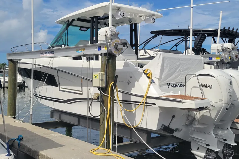 The Image of 2025 Jeanneau Leader 10.5 WA Series 2 boat docked with Yamaha engines. - 1