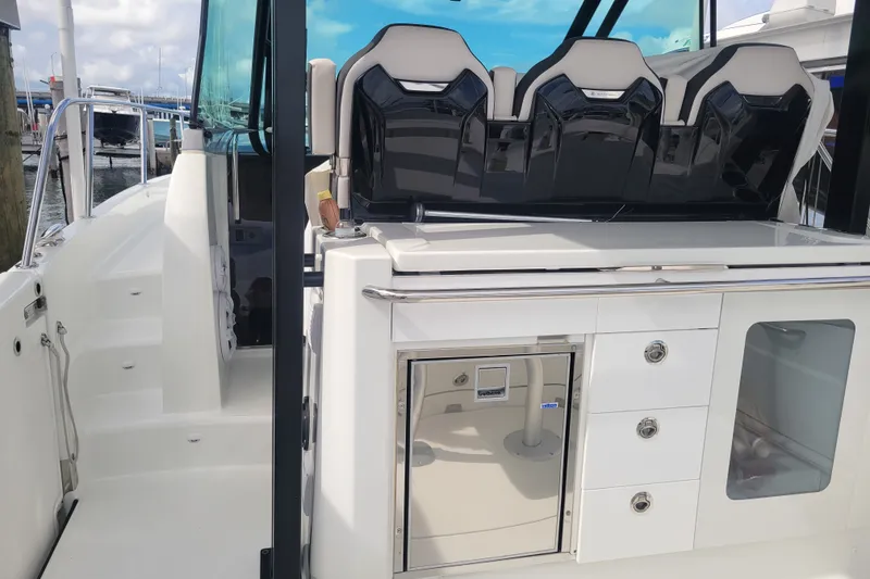 Slide: The Image of 2025 Jeanneau Leader 10.5 WA Series 2 boat interior with seating and storage compartments. - 9