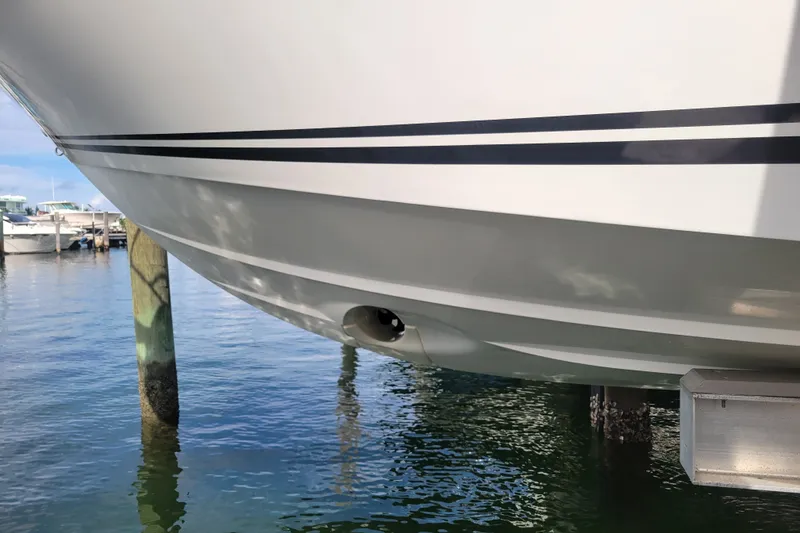 Slide: The Image of 2025 Jeanneau Leader 10.5 WA Series 2 boat hull at marina dock. - 5