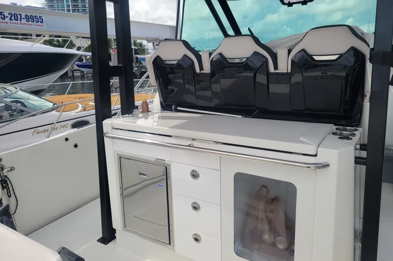 Slide: The Image of 2025 Jeanneau Leader 10.5 WA Series 2 boat interior with seating and storage. - 10