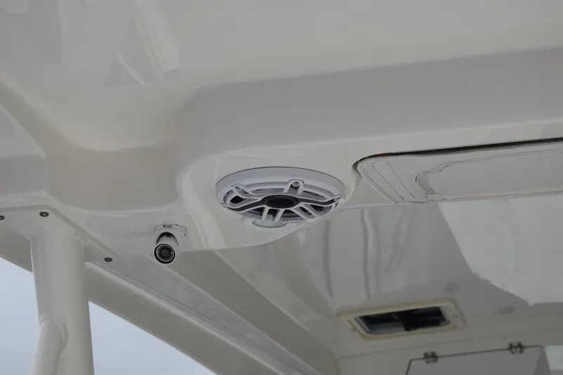 Slide: The Image of 2022 Pursuit OS 355 Offshore boat ceiling with speaker and light fixture. - 23