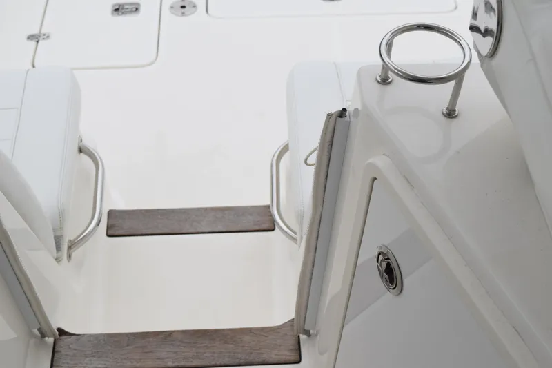 Slide: The Image of 2022 Pursuit OS 355 Offshore boat deck with seating and stainless steel fixtures. - 174