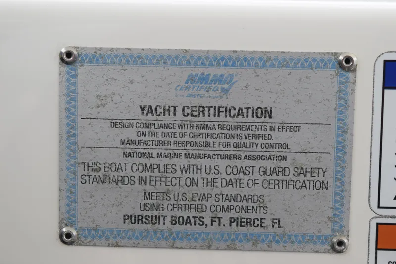 Slide: The Image of 2022 Pursuit OS 355 Offshore yacht certification plaque, NMMA compliance, U.S. Coast Guard standards. - 292