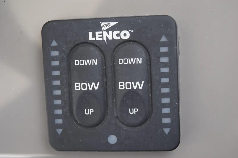 Slide: The Image of Lenco trim tab control panel on 2022 Pursuit OS 355 Offshore boat. - 297