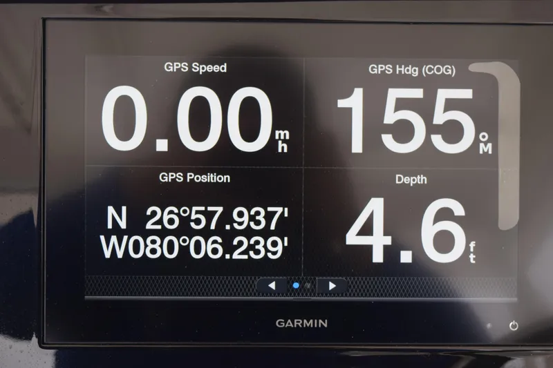 Slide: The Image of Garmin GPS display on 2022 Pursuit OS 355 Offshore showing speed, heading, position, and depth. - 276