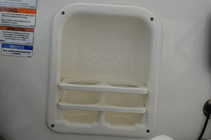 Slide: The Image of Cup holder and warning labels on 2022 Pursuit OS 355 Offshore boat. - 265