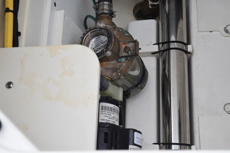 Slide: The Image of Engine compartment of 2022 Pursuit OS 355 Offshore boat, showing mechanical components. - 128