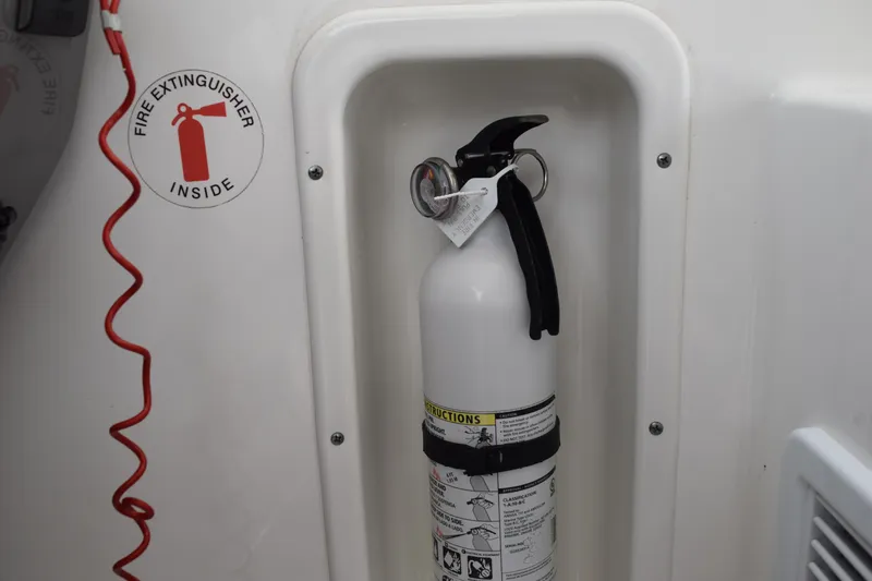 Slide: The Image of Fire extinguisher in 2022 Pursuit OS 355 Offshore boat compartment. - 270