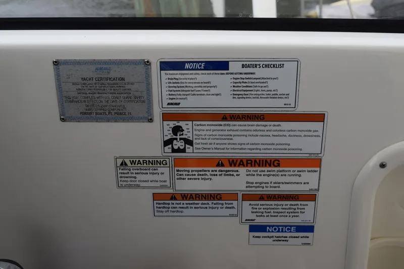 Slide: The Image of 2022 Pursuit OS 355 Offshore safety warnings and boater's checklist on yacht certification panel. - 290