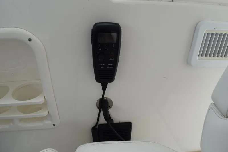 Slide: The Image of VHF radio mounted on 2022 Pursuit OS 355 Offshore boat interior. - 259