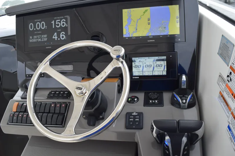 Slide: The Image of 2022 Pursuit OS 355 Offshore helm with advanced navigation and control systems. - 302