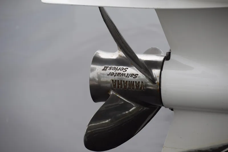 Slide: The Image of Close-up of Yamaha Saltwater Series II propeller on 2022 Pursuit OS 355 Offshore boat. - 451