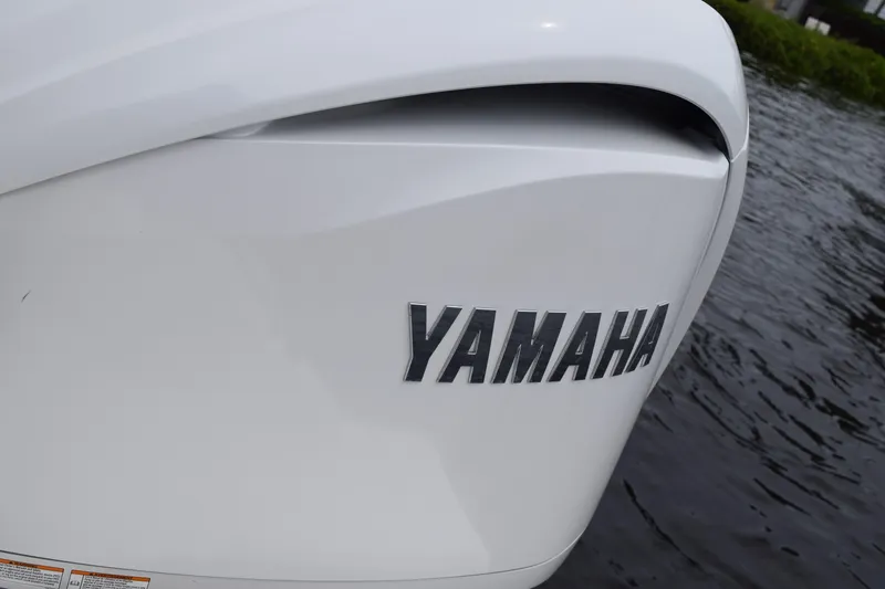 Slide: The Image of Close-up of Yamaha engine on 2022 Pursuit OS 355 Offshore boat. - 88