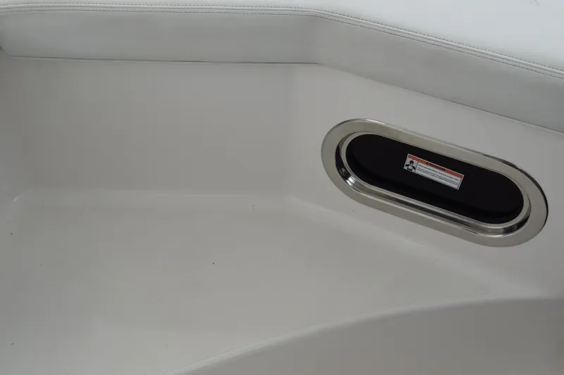 Slide: The Image of Interior detail of 2022 Pursuit OS 355 Offshore boat, featuring sleek seating and oval window. - 240