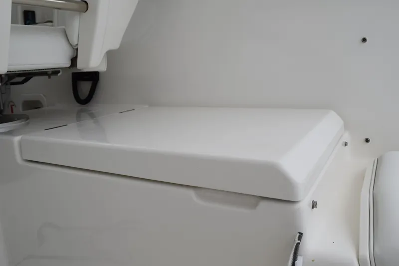 Slide: The Image of 2022 Pursuit OS 355 Offshore boat interior seating area, white and sleek design. - 184