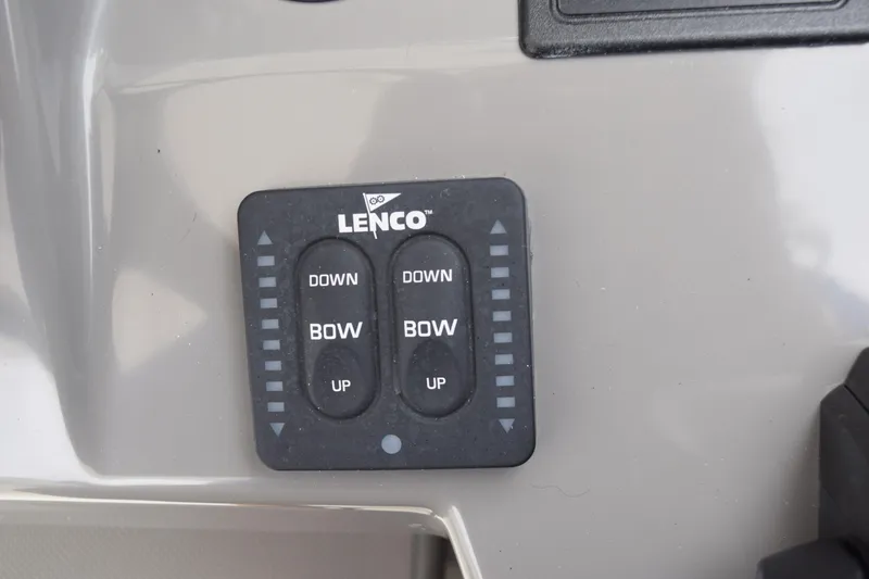 Slide: The Image of Lenco trim tab control on 2022 Pursuit OS 355 Offshore boat dashboard. - 296