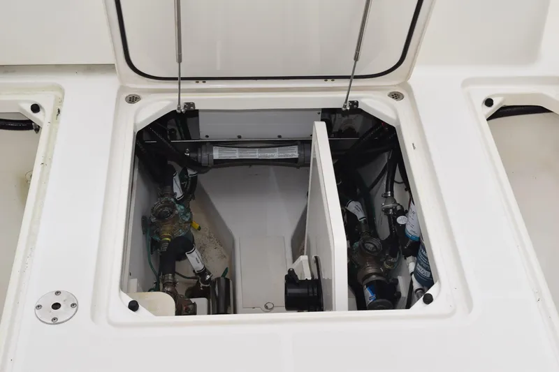 Slide: The Image of 2022 Pursuit OS 355 Offshore engine compartment with visible mechanical components. - 148