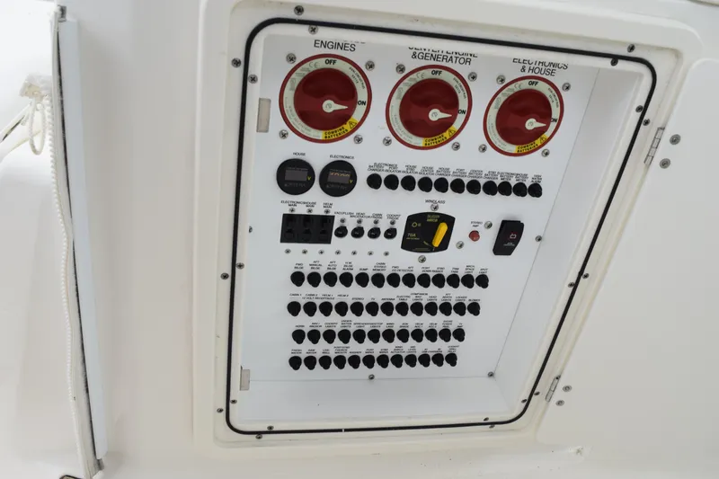 Slide: The Image of Electrical control panel on a 2022 Pursuit OS 355 Offshore boat. - 167