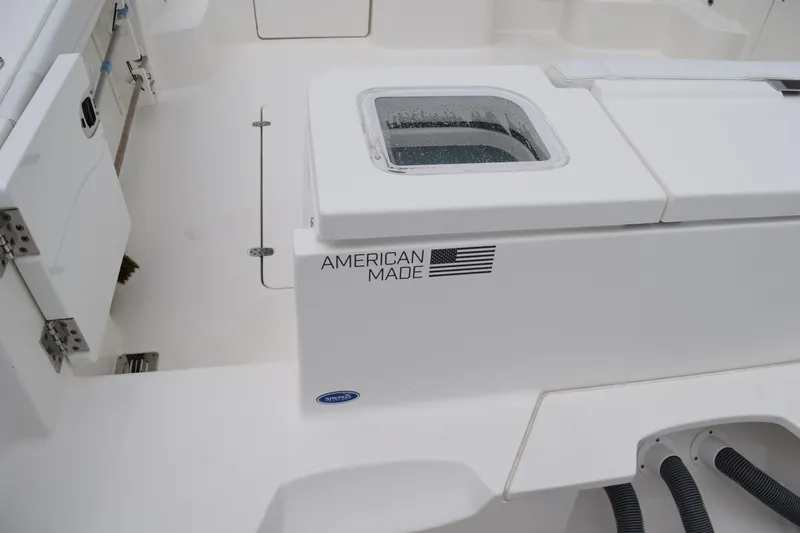 Slide: The Image of 2022 Pursuit OS 355 Offshore boat interior with "American Made" label. - 71