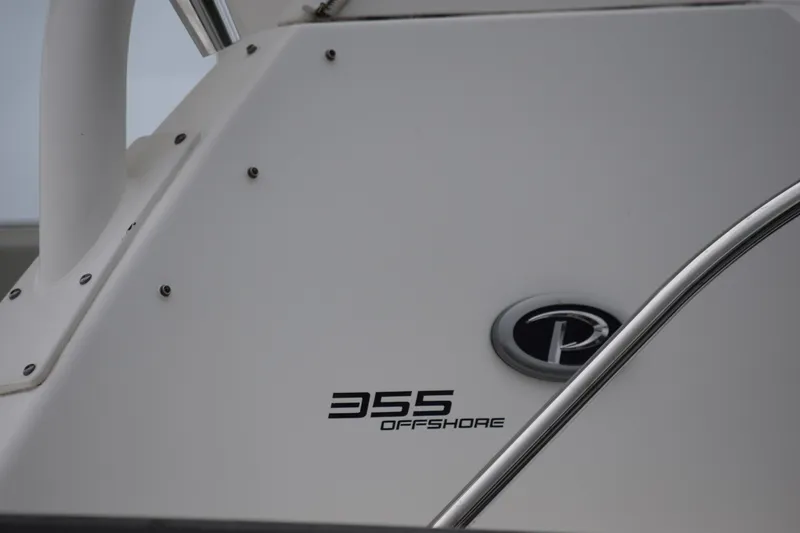 Slide: The Image of 2022 Pursuit OS 355 Offshore boat detail with logo and model name. - 461