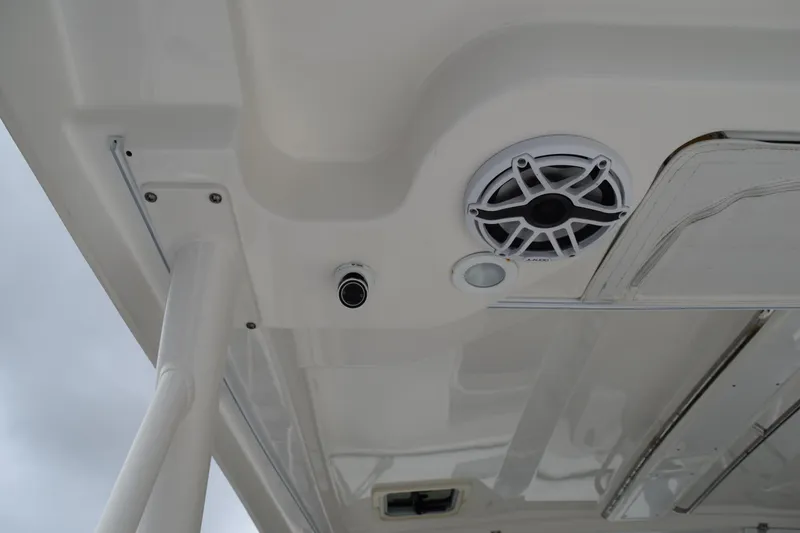 Slide: The Image of 2022 Pursuit OS 355 Offshore boat ceiling with speaker and light fixture. - 24