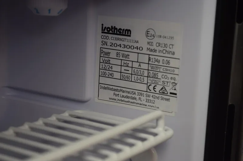 Slide: The Image of Label inside a refrigerator on a 2022 Pursuit OS 355 Offshore boat. - 421