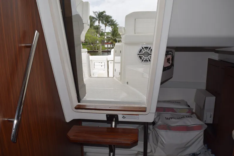 Slide: The Image of Interior view of 2022 Pursuit OS 355 Offshore boat, showing cabin and deck access. - 348