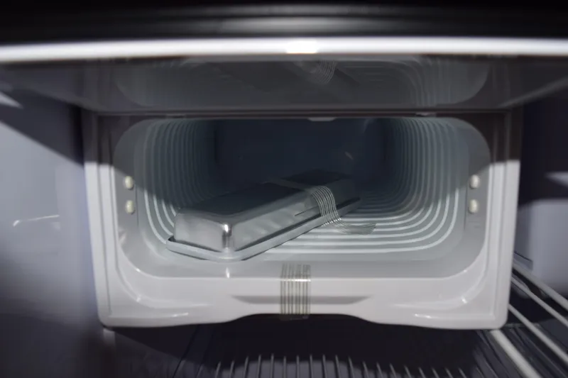 Slide: The Image of Empty freezer compartment in 2022 Pursuit OS 355 Offshore boat. - 422