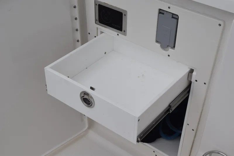 Slide: The Image of Open storage compartment on 2022 Pursuit OS 355 Offshore boat. - 44