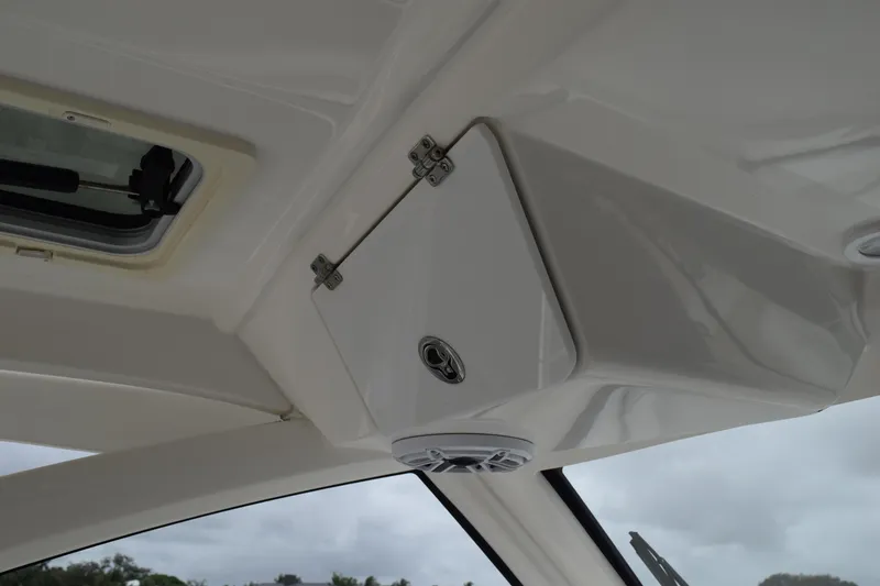Slide: The Image of 2022 Pursuit OS 355 Offshore boat interior ceiling with hatch and speaker. - 206