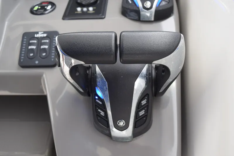 Slide: The Image of Throttle controls on 2022 Pursuit OS 355 Offshore boat dashboard. - 294