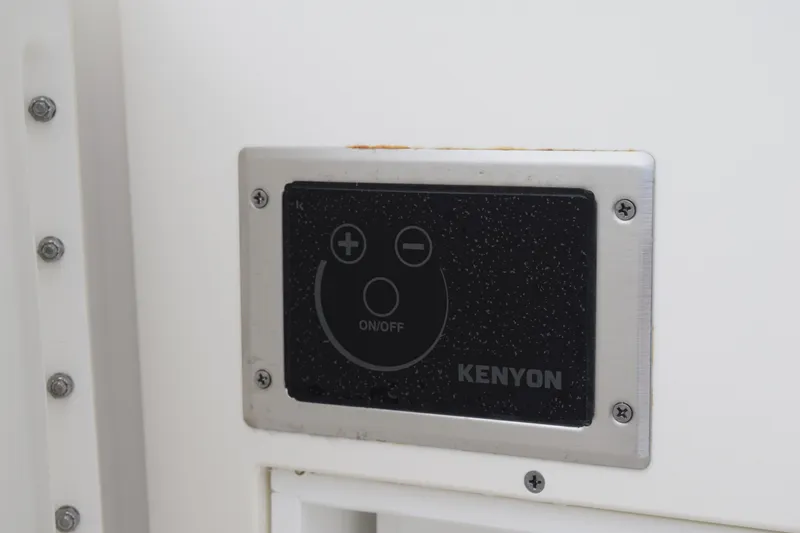 Slide: The Image of Control panel on 2022 Pursuit OS 355 Offshore boat, featuring Kenyon interface. - 39