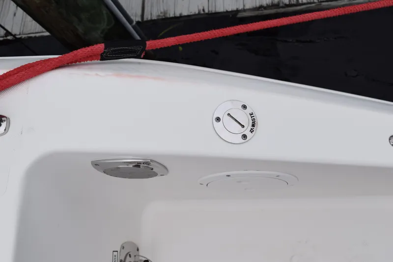 Slide: The Image of 2022 Pursuit OS 355 Offshore boat deck with waste cap and red rope. - 101
