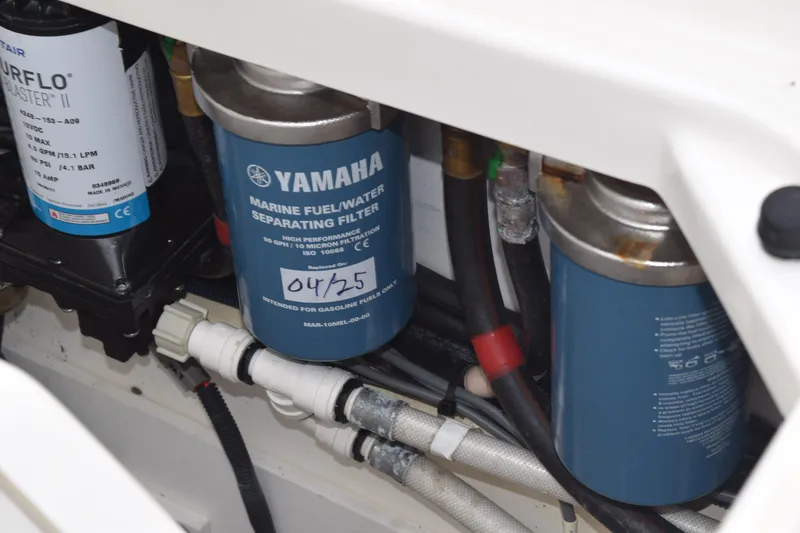 Slide: The Image of Engine compartment of 2022 Pursuit OS 355 Offshore with Yamaha marine fuel filter. - 134