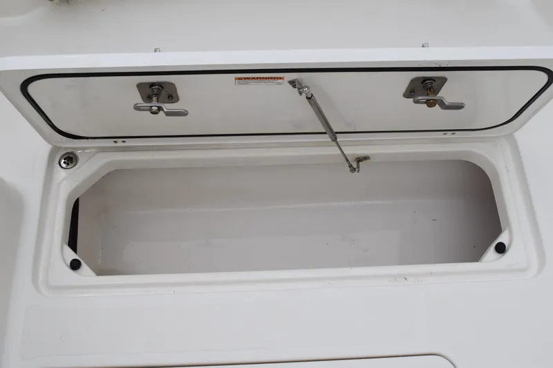 Slide: The Image of Open storage compartment on 2022 Pursuit OS 355 Offshore boat. - 121